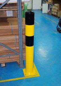 Image of a black and yellow striped protection post